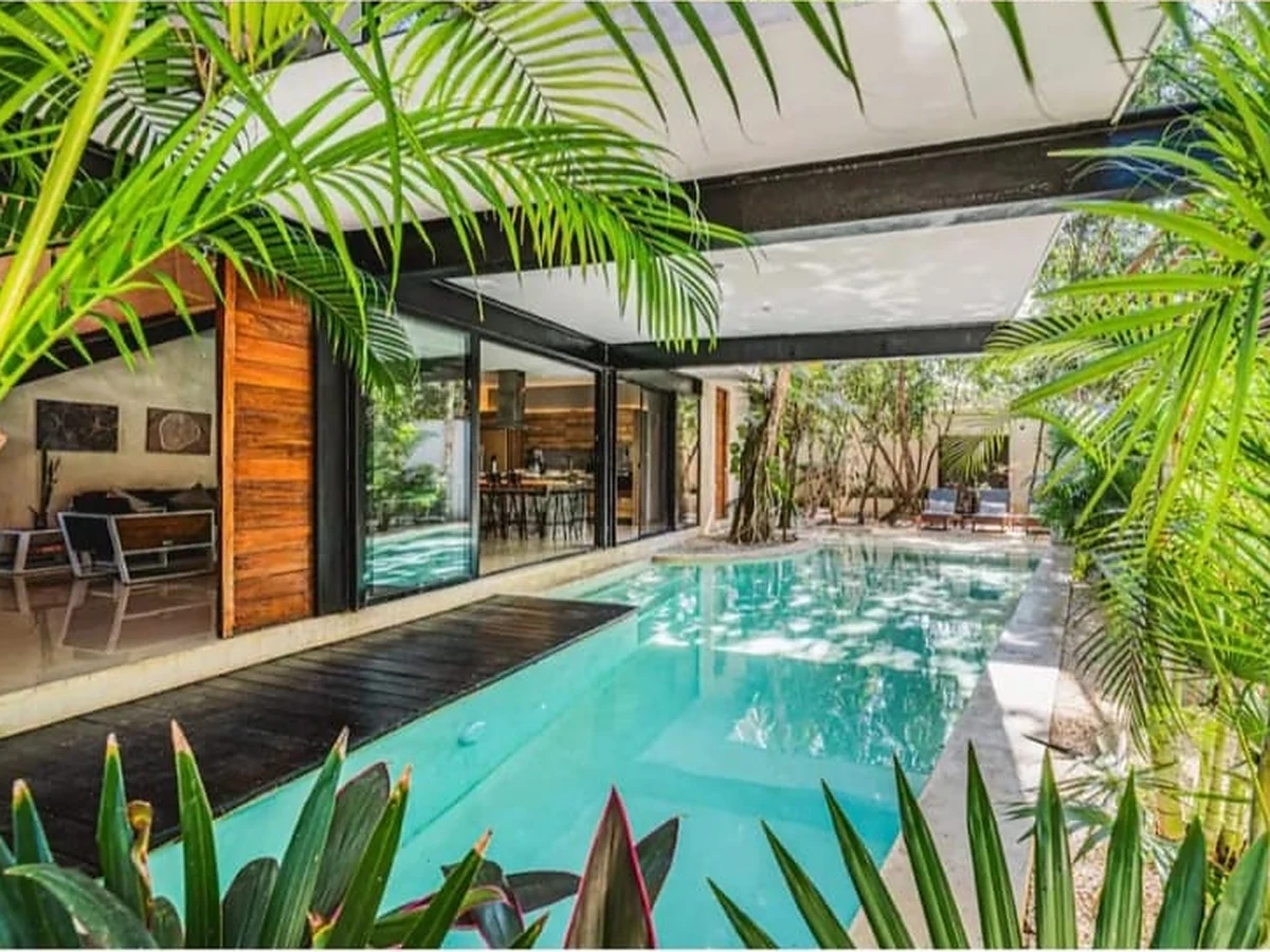 The villa pool and open living space