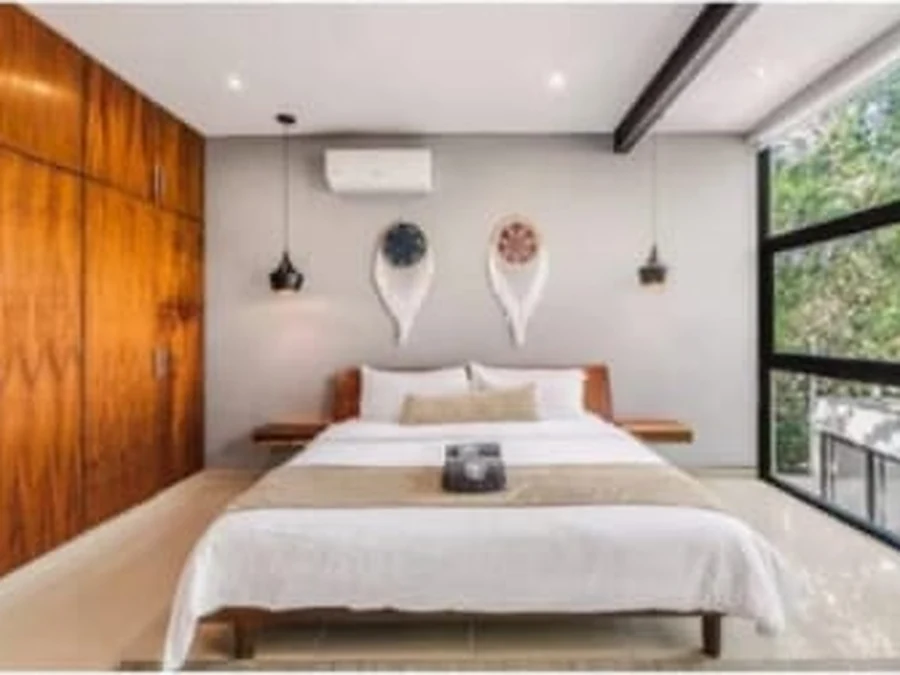 Bedroom with full-height wooden wardrobe